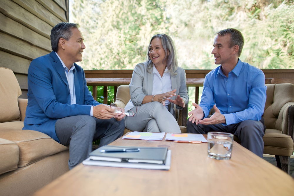 mature-senior-business-colleagues-collaborating-discussing-ideas-meeting-with-laptop-computer1